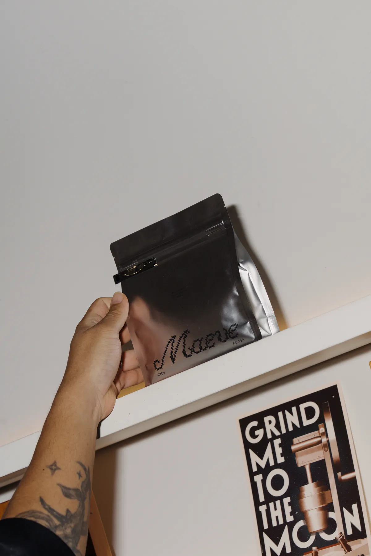 Hand holding a Maeve coffee bag